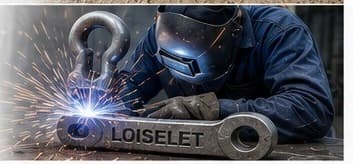 Welder working on a steel shackle