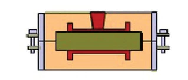Photo The caster then proceeds to pour the molten alloy into the mold.
